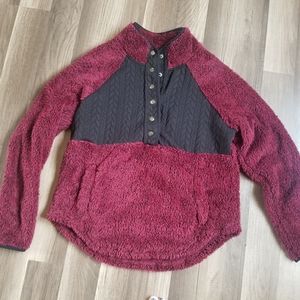 Plum colored pullover.